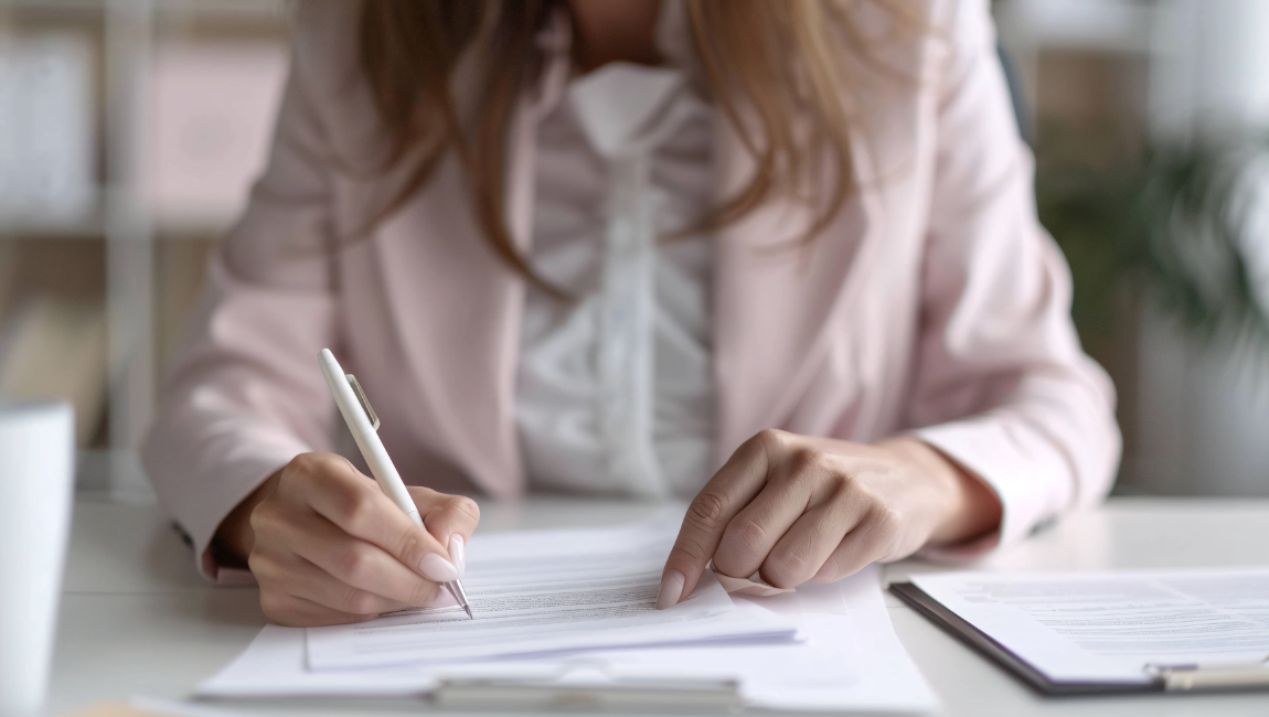 Signing real estate closing documents for Central NH transaction