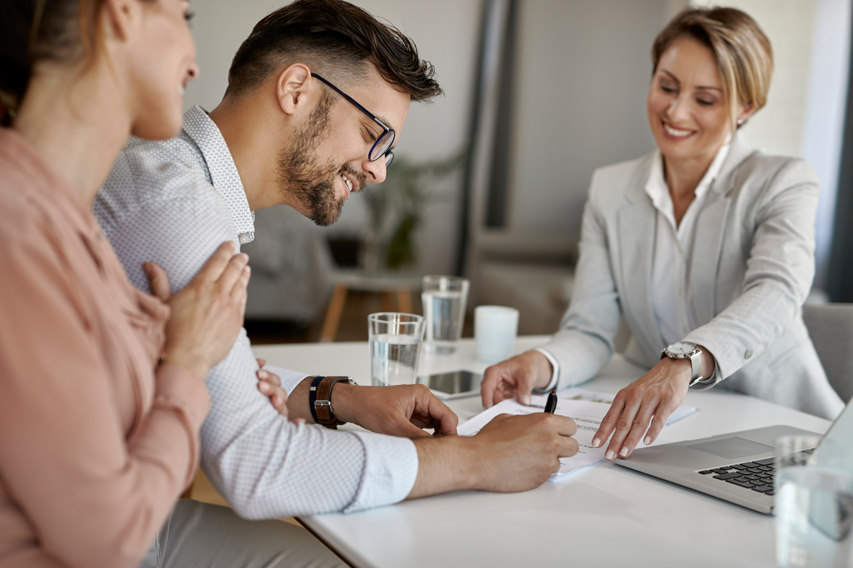 Signing refinance closing documents at Simple Title