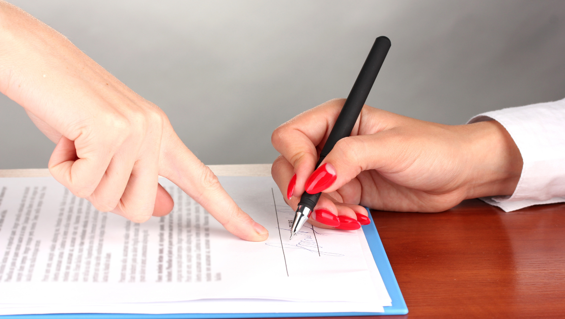 Signing a real estate deed to hold title to property
